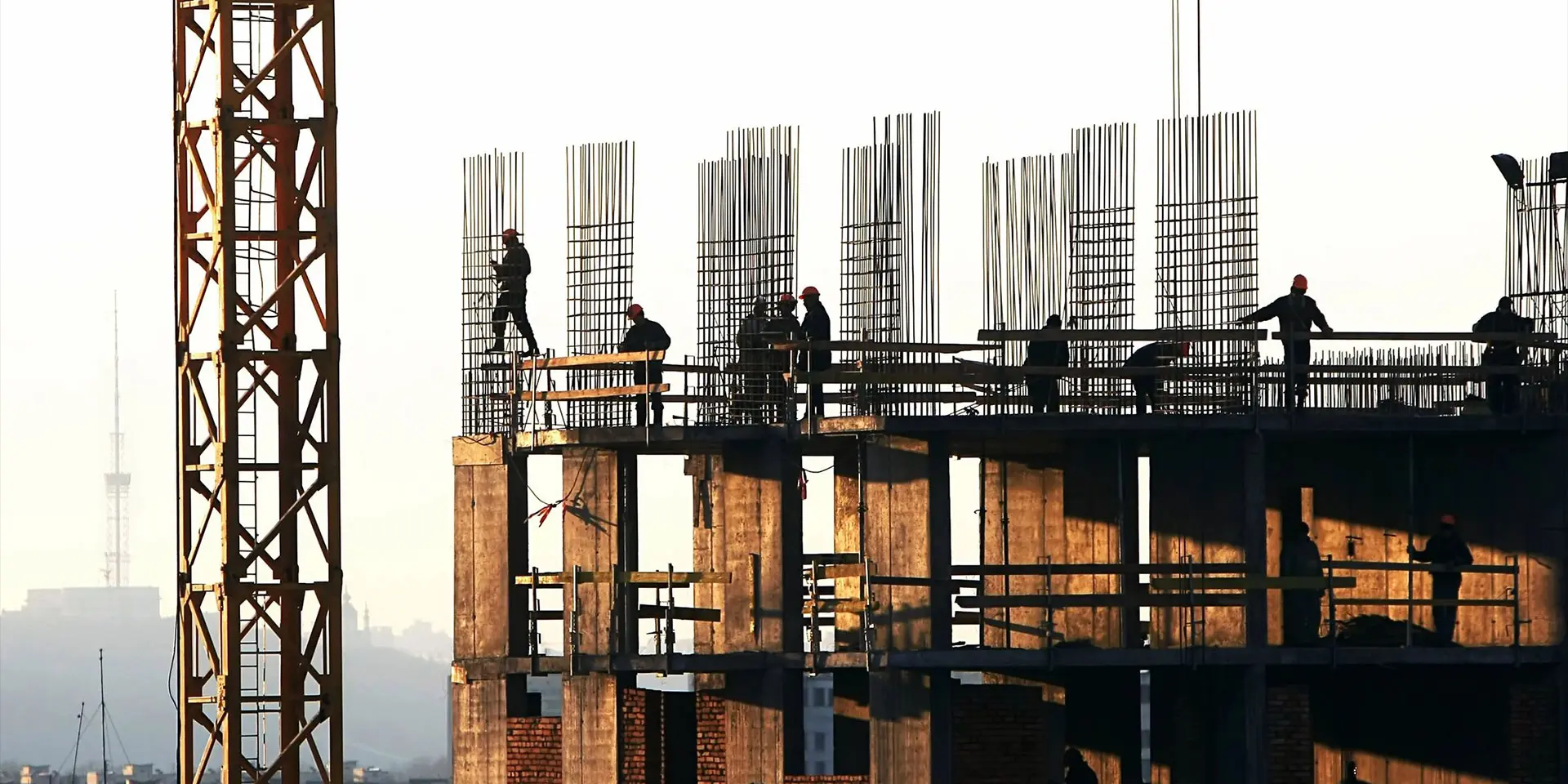 Workers at concrete High-rise construction site